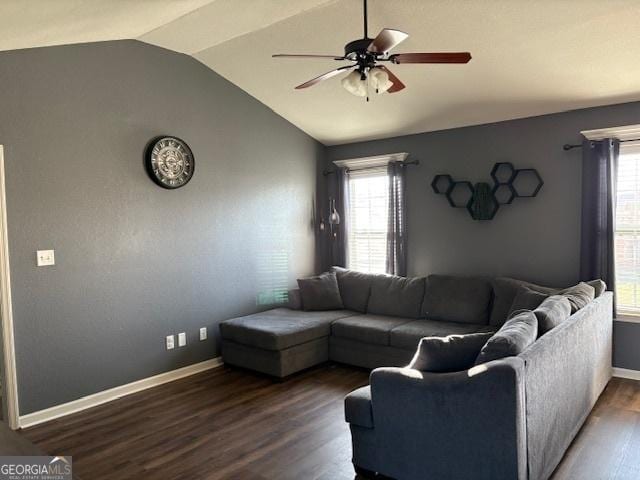 living room with ceiling fan, dark hardwood / wood-style floors, and vaulted ceiling