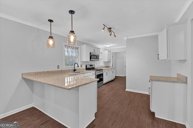 4138 Hickory Dr, Powder Springs, GA 30127 - kitchen featuring appliances with stainless steel finishes, decorative light fixtures, sink, white cabinets, and kitchen peninsula