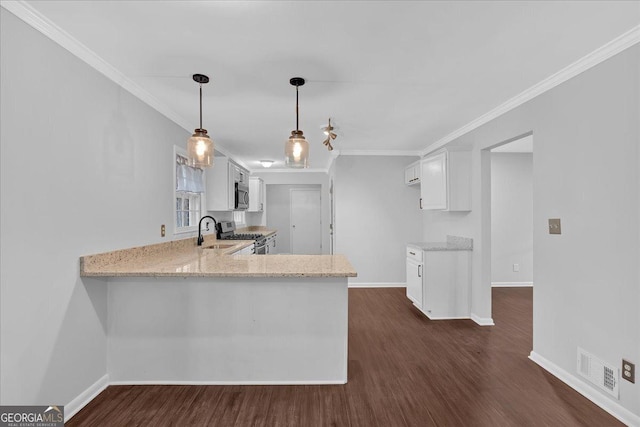 4138 Hickory Dr, Powder Springs, GA 30127 - kitchen featuring appliances with stainless steel finishes, kitchen peninsula, light stone countertops, and white cabinets