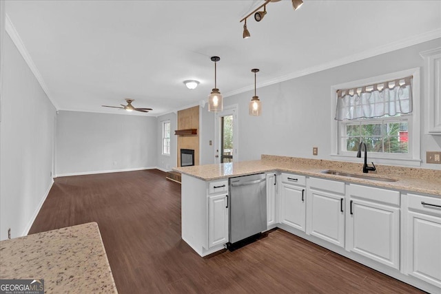 4138 Hickory Dr, Powder Springs, GA 30127 - kitchen featuring sink, dishwasher, a fireplace, white cabinets, and decorative light fixtures