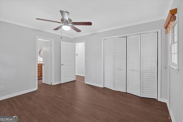 4138 Hickory Dr, Powder Springs, GA 30127 - unfurnished bedroom with ornamental molding, dark hardwood / wood-style flooring, and a closet
