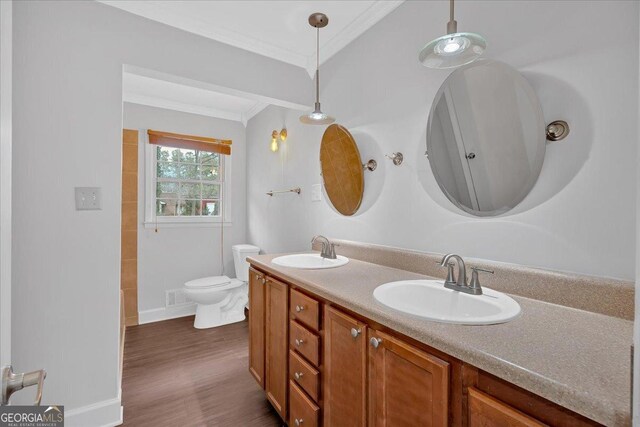 4138 Hickory Dr, Powder Springs, GA 30127 - bathroom with ornamental molding, toilet, wood-type flooring, and vanity