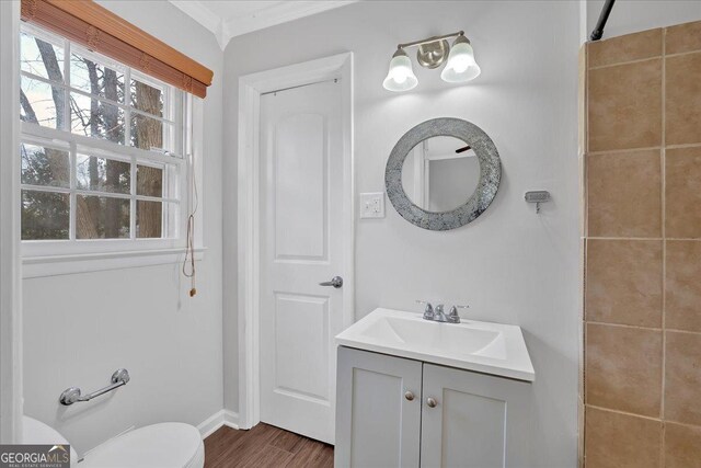 4138 Hickory Dr, Powder Springs, GA 30127 - bathroom featuring hardwood / wood-style flooring, vanity, crown molding, and toilet