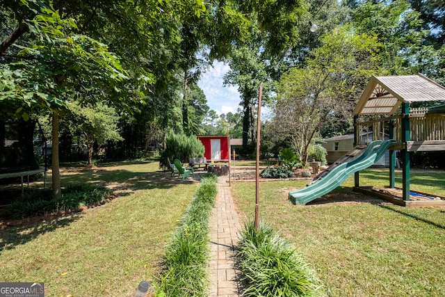 4138 Hickory Dr, Powder Springs, GA 30127 - view of yard with a trampoline and a playground