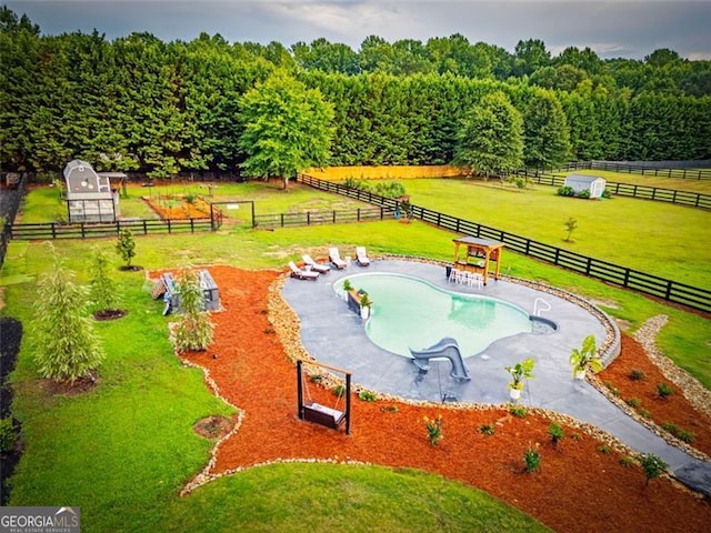 birds eye view of property featuring a rural view