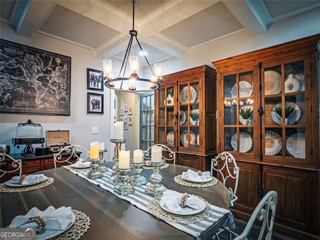 dining space featuring coffered ceiling, beam ceiling, a chandelier, and hardwood / wood-style flooring