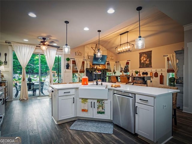 kitchen featuring decorative light fixtures, dishwasher, sink, and a center island with sink