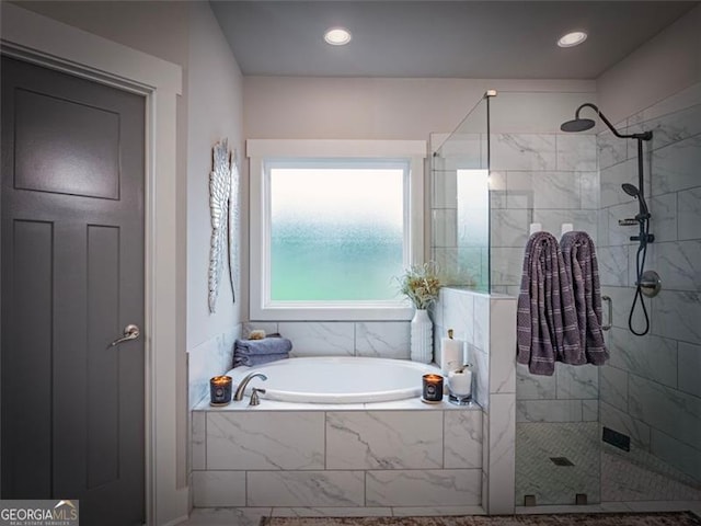 bathroom featuring plus walk in shower