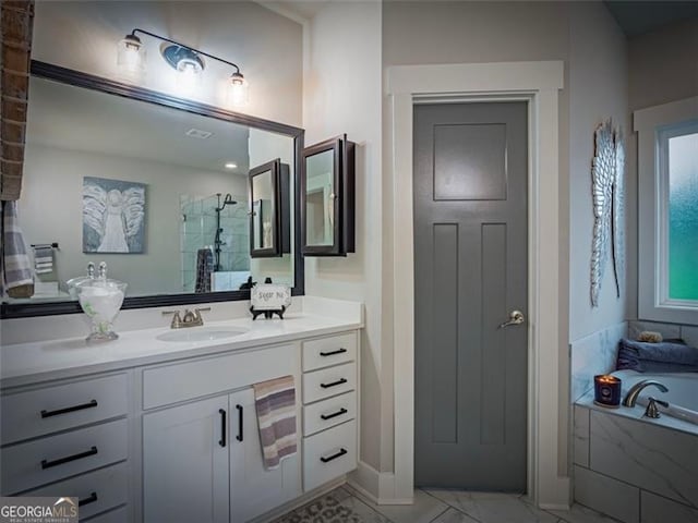 bathroom featuring independent shower and bath and vanity