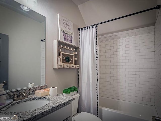 full bathroom featuring vanity, toilet, and shower / tub combo