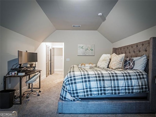 carpeted bedroom featuring vaulted ceiling