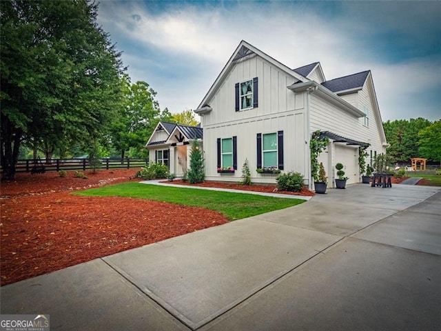 modern inspired farmhouse featuring a garage