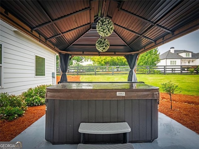 view of patio / terrace with a gazebo and a hot tub