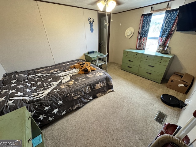 carpeted bedroom with ceiling fan