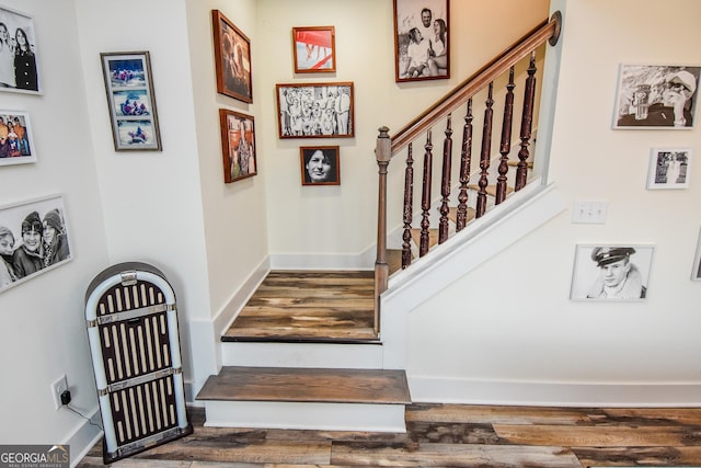 staircase featuring hardwood / wood-style floors