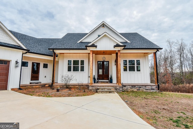 view of front facade with a garage and a porch