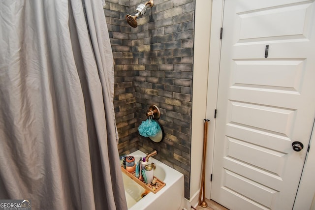 bathroom featuring shower / bathtub combination with curtain