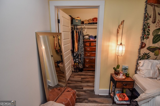 corridor with dark hardwood / wood-style floors