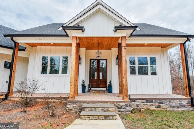 property entrance featuring french doors and covered porch