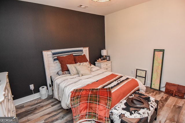 bedroom featuring hardwood / wood-style flooring