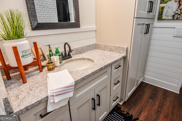 bathroom featuring vanity and hardwood / wood-style floors