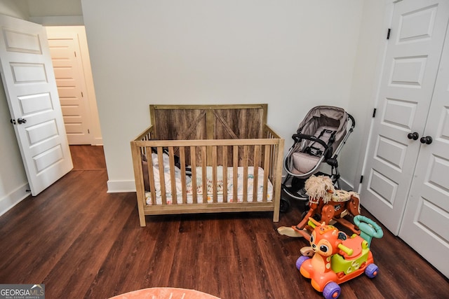 bedroom featuring dark hardwood / wood-style flooring