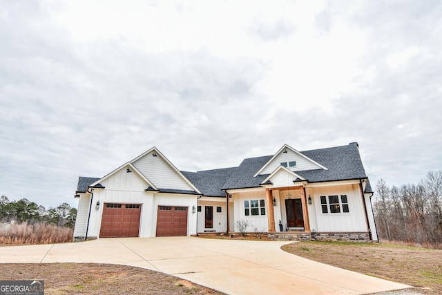 modern inspired farmhouse featuring a garage