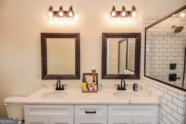 bathroom featuring vanity, an enclosed shower, and toilet