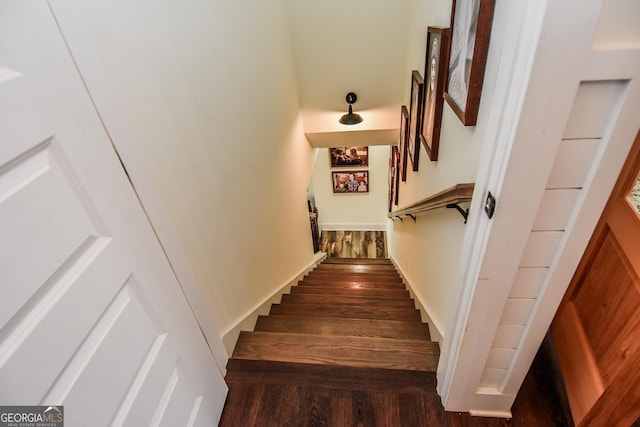 stairs with hardwood / wood-style flooring