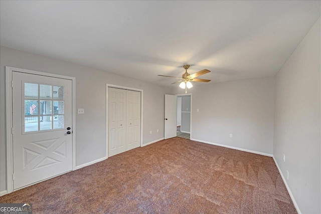 interior space featuring carpet floors, a closet, and ceiling fan