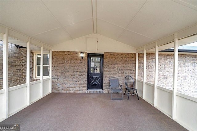 unfurnished sunroom with vaulted ceiling