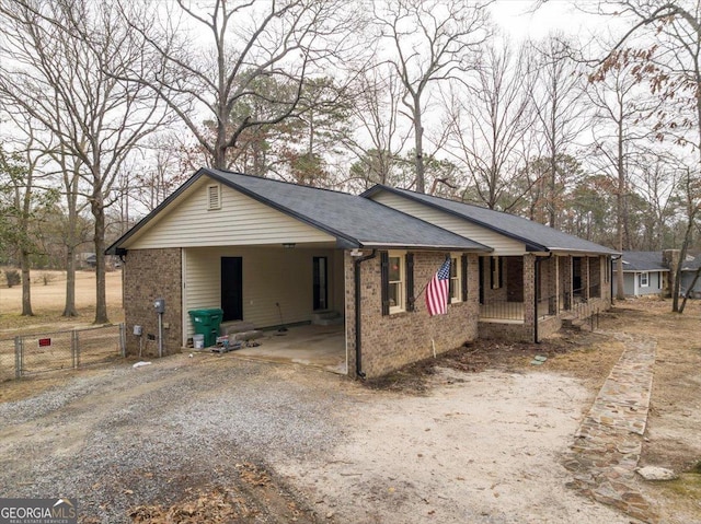 ranch-style home with a carport