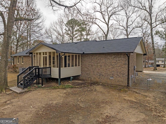 back of house with a sunroom