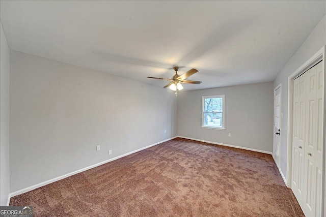 unfurnished bedroom featuring carpet flooring, ceiling fan, and a closet