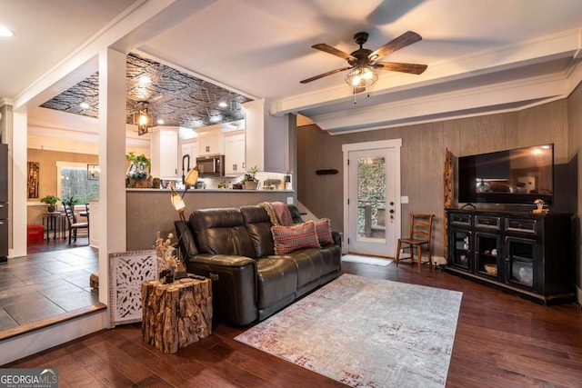 185 Huckleberry Cove Rd, Jasper, GA 30143 - living area featuring a ceiling fan, wooden walls, dark wood-type flooring, beamed ceiling, and crown molding