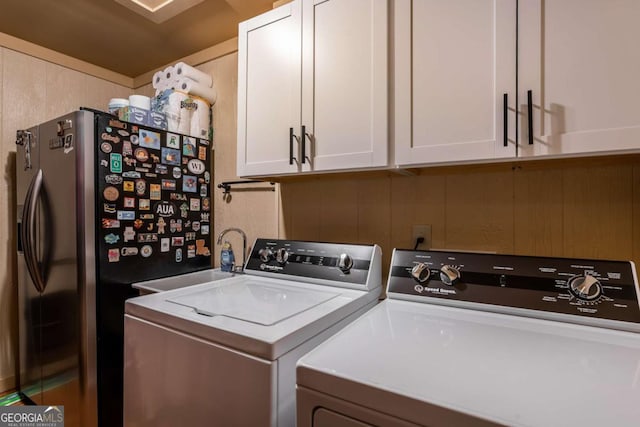 185 Huckleberry Cove Rd, Jasper, GA 30143 - laundry area featuring separate washer and dryer and cabinet space