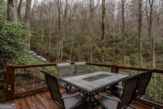 185 Huckleberry Cove Rd, Jasper, GA 30143 - deck featuring outdoor dining space and a forest view