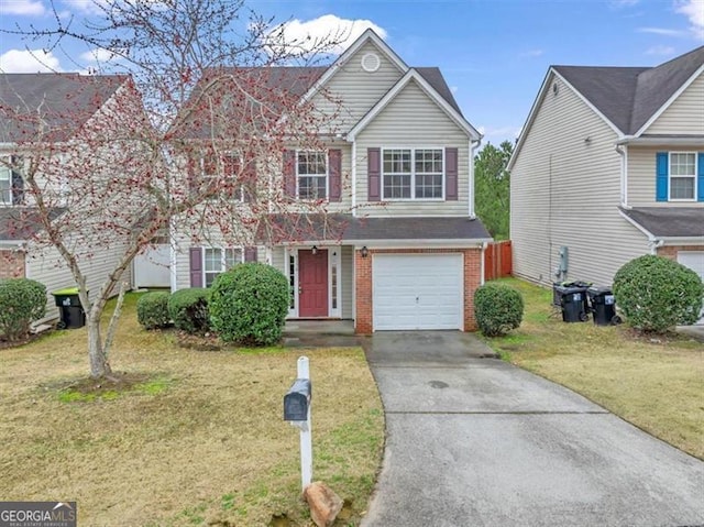 view of front of property featuring a garage and a front yard