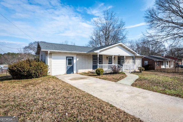 ranch-style house with a front lawn and a porch