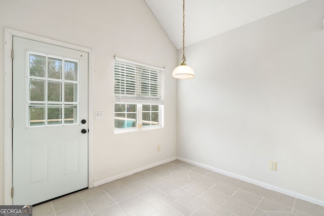 doorway to outside featuring lofted ceiling