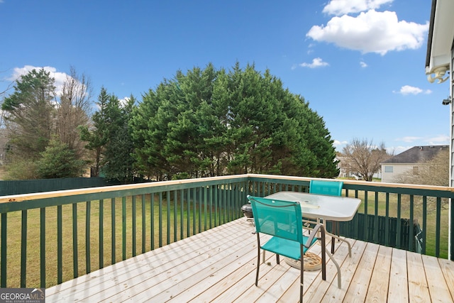 deck featuring a lawn