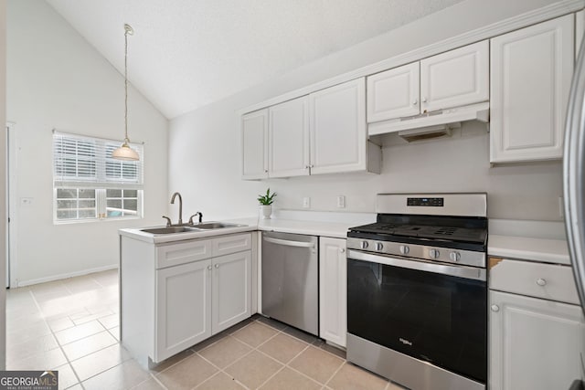 kitchen with hanging light fixtures, kitchen peninsula, white cabinets, and appliances with stainless steel finishes