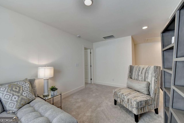 sitting room with carpet floors