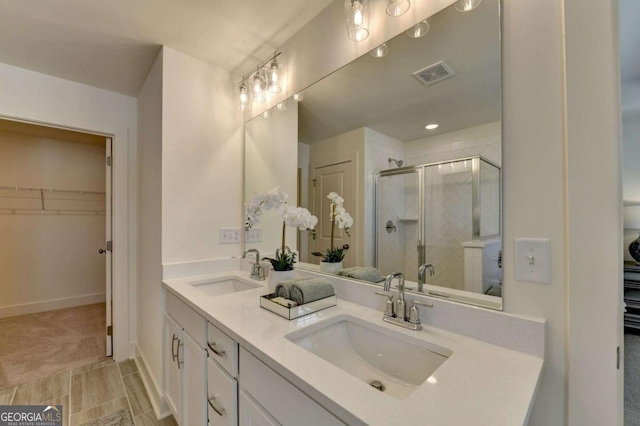 bathroom featuring vanity and walk in shower