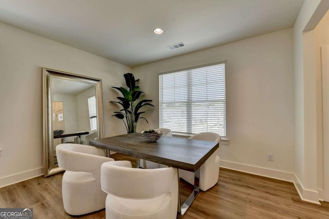 dining space featuring hardwood / wood-style flooring