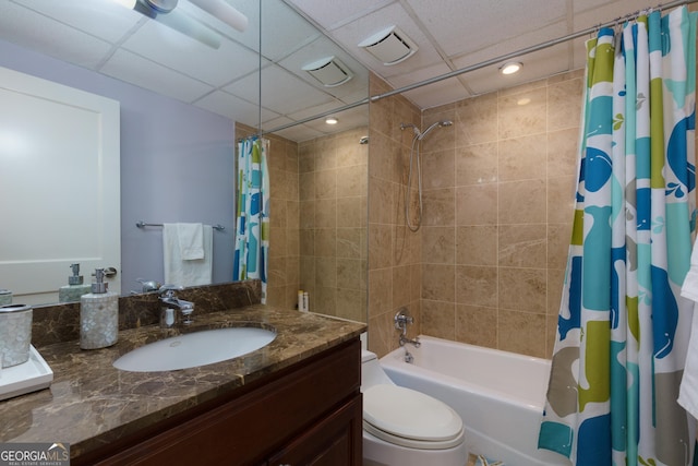 bathroom featuring visible vents, shower / bath combination with curtain, vanity, and toilet