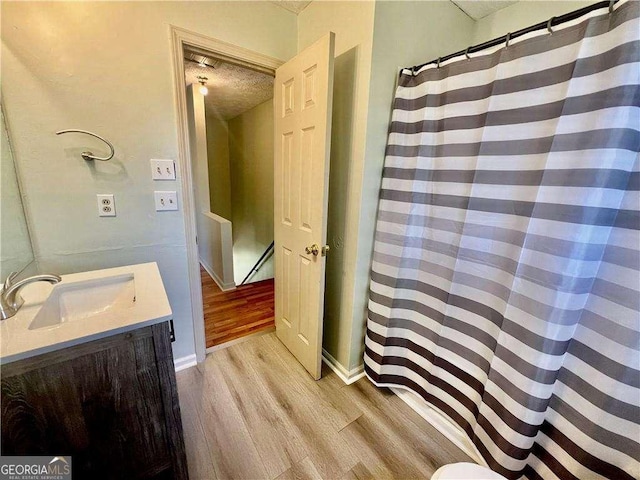 bathroom featuring vanity and hardwood / wood-style flooring