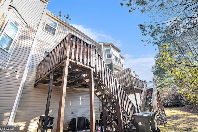 rear view of property with a wooden deck