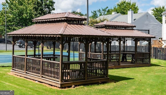 surrounding community featuring a gazebo and a lawn