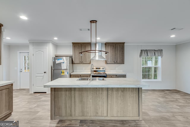 kitchen featuring crown molding, light countertops, visible vents, appliances with stainless steel finishes, and a sink